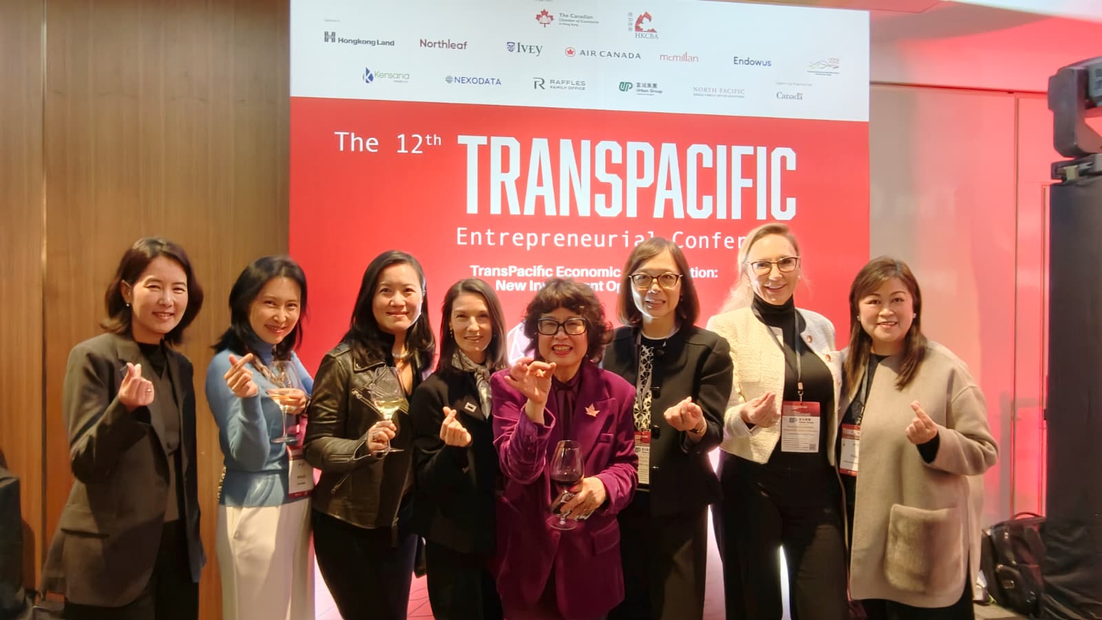 Corporate Training Hong Kong with the Cancham during the Transpacific event red background with the sponsors Hongkong Land, Northleaf, Ivey, Air Canada, Mcmilan, Endowus, Kensana, Nexodata, Raffles, North pacific